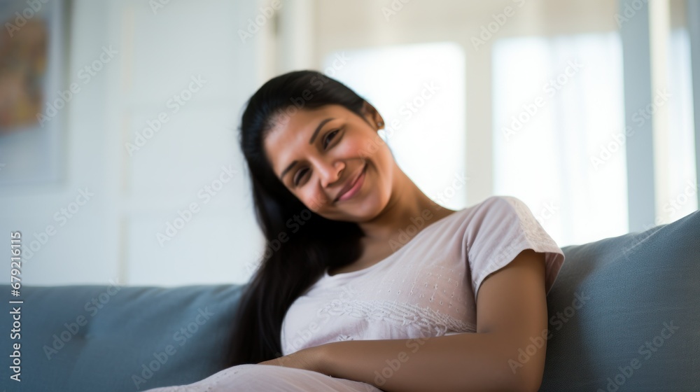 Pregnant woman in the living room Pregnant woman in the living room