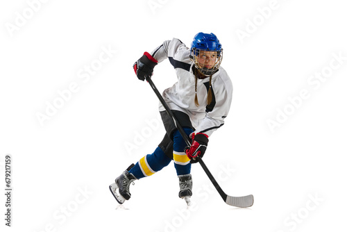 Young girl, professional hockey player in motion during game, playing isolated over white background. Achievements. Concept of professional sport, competition, game, action, hobby, success
