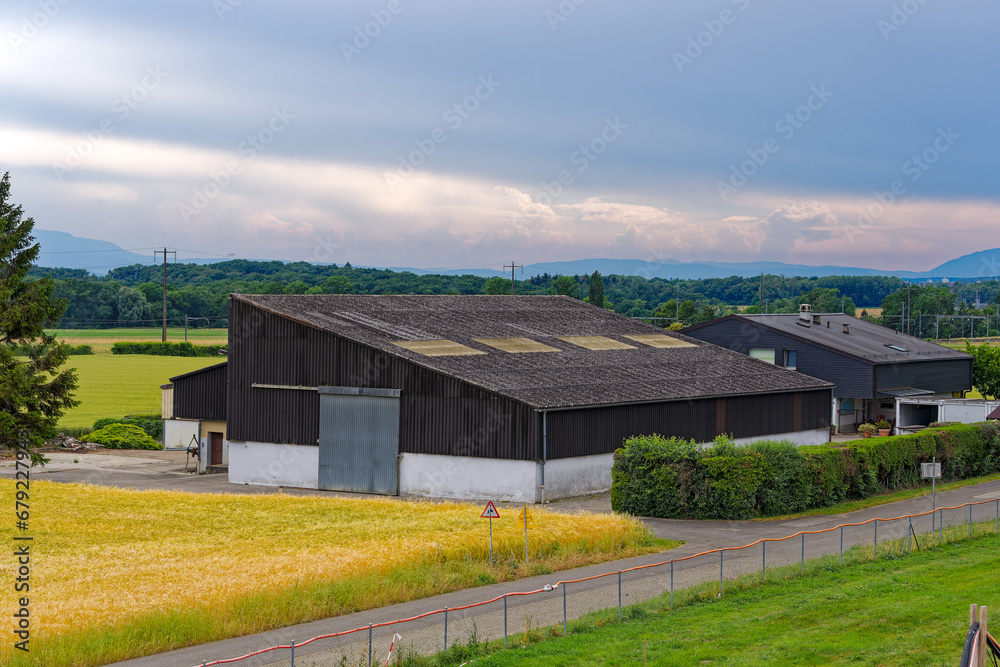 Scenic agriculture landscape at Swiss highway service station Rose de la Broye on a cloudy late spring day. Photo taken June 11th, 2023, Lully, Switzerland.