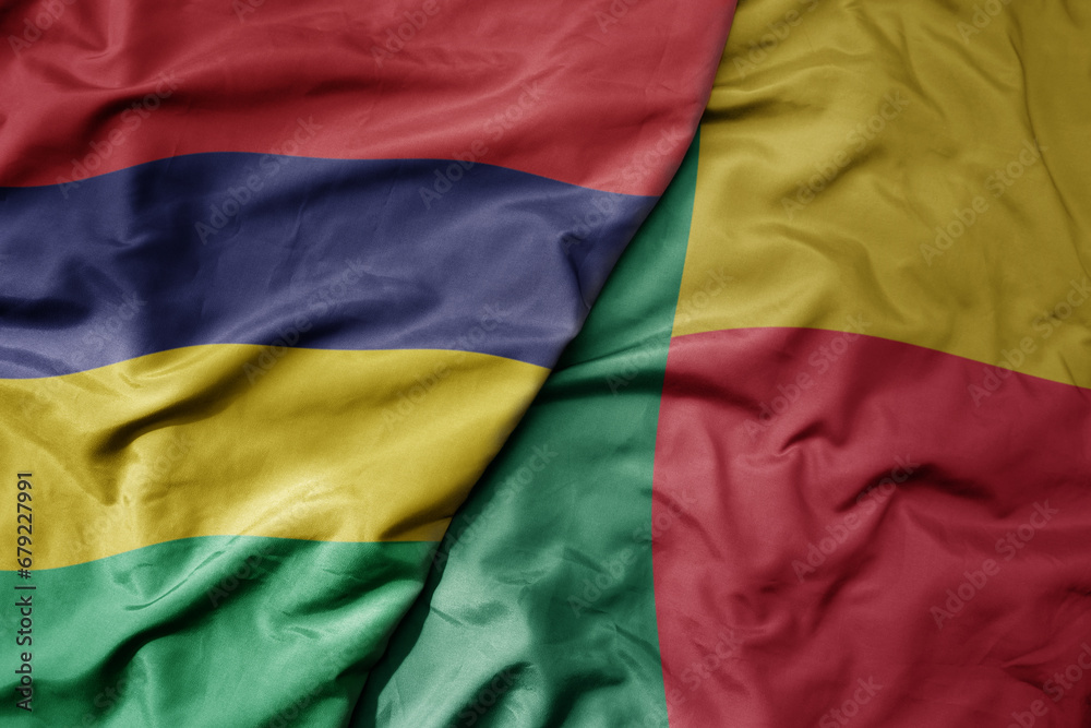 big waving national colorful flag of mauritius and national flag of benin