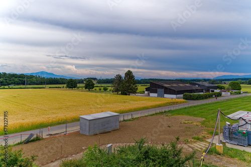 Scenic agriculture landscape at Swiss highway service station Rose de la Broye on a cloudy late spring day. Photo taken June 11th, 2023, Lully, Switzerland.