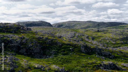 Landscape of green polar rocky tundra. Northern nature of Teriberka