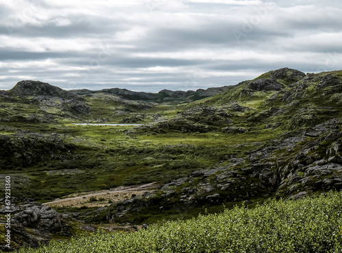 Landscape of green polar rocky tundra. Northern nature of Teriberka