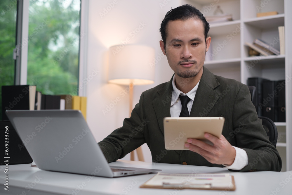 Close up of happy smile professional manager businessman using tablet in office for communication. Using tablet in workplace electronic transactions takl aboub business, shopping online. Close up of happy smile professional manager businessman using tablet in office for communication. Using tablet in workplace electronic transactions takl aboub business, shopping online.
