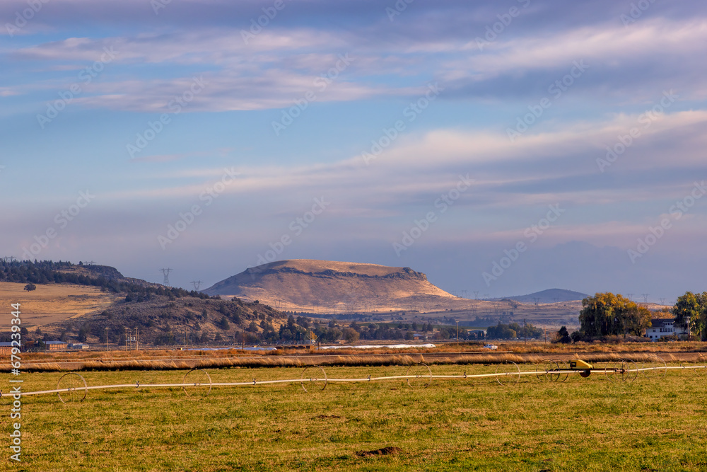 Horse mountain seen in the distance in the agricultural landscape.