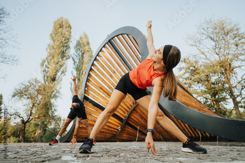 Active Caucasian Couple Exercising in Natural Outdoor Park © qunica.com