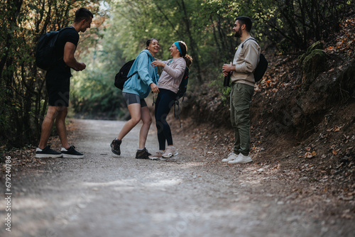 Group of friends hike in the autumn forest, enjoying conversations and the natural environment. They embrace the outdoors and engage in physical activity, creating a healthy and fun-filled adventure.