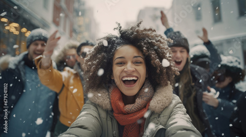 People from diverse cultures enjoying a snowy game of charades photo