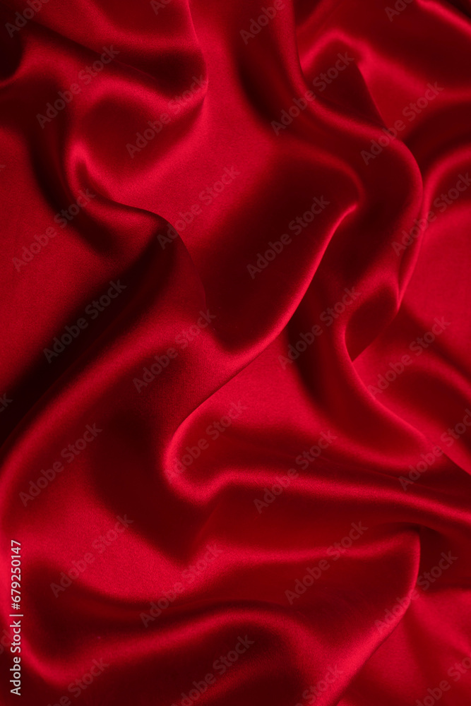 Obraz premium Red silk or satin luxury fabric texture can use as abstract background.