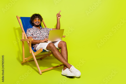 Full length photo of young male sunbed point empty space dressed stylish pink leopard print garment isolated on yellow color background