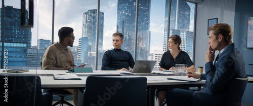 Multiethnic Diverse Office Conference Room Meeting: Team of Three Creative Entrepreneurs Talk, Discuss Growth Strategy. Young Businesspeople Work on Digital e-Commerce Startup Project.