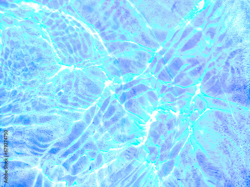 Blue wave abstracts or natural rippled water texture background Water waves in sunlight. Blurred transparent Blue colored clear calm water surface texture with splashes and bubbles.