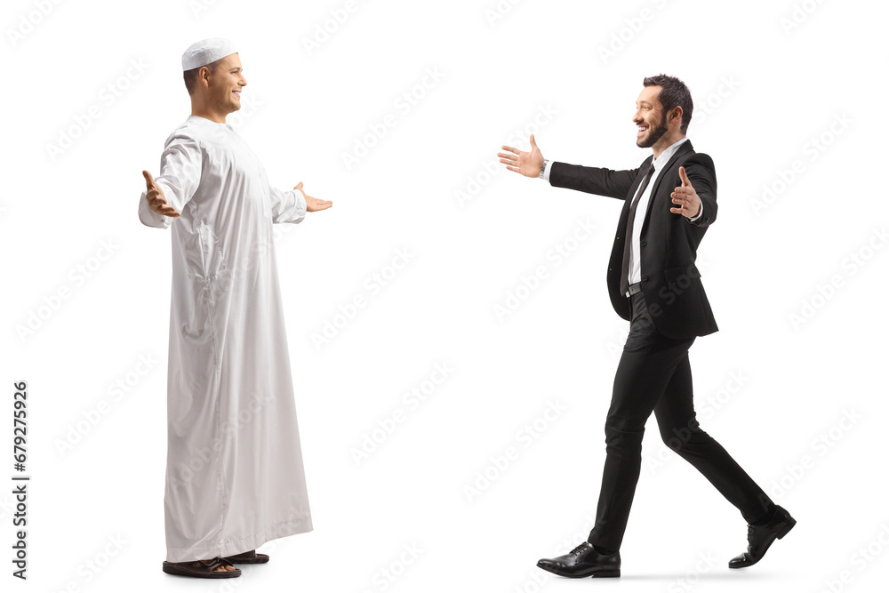 Businessman meeting a muslim friend in ethnic clothes
