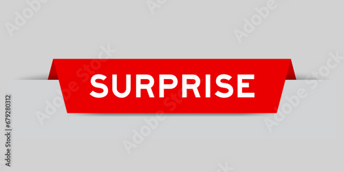 Red color inserted label with word surprise on gray background