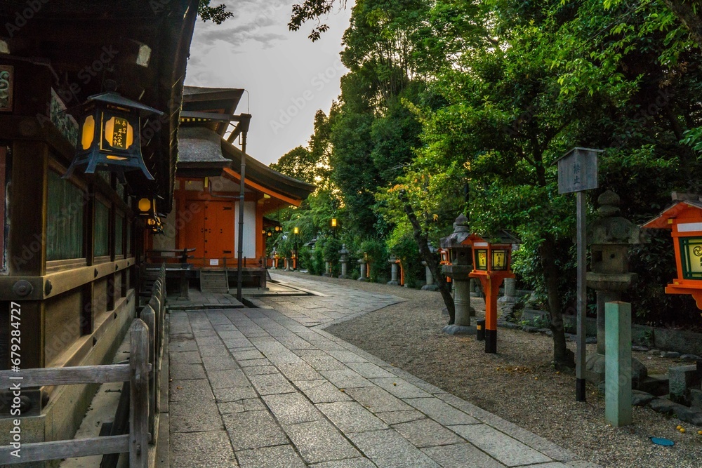 street with a path leading through it and lanterns at the edge