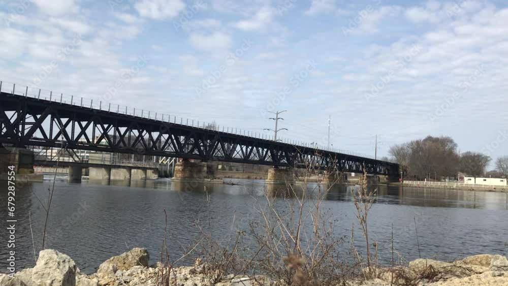 The Rock River flows under a railroad bridge in Rockford, Illinois. The Rock River flows under a railroad bridge in Rockford, Illinois.