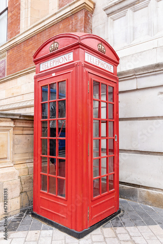 London phone booth. An iconic red phone in London cabin in a city street