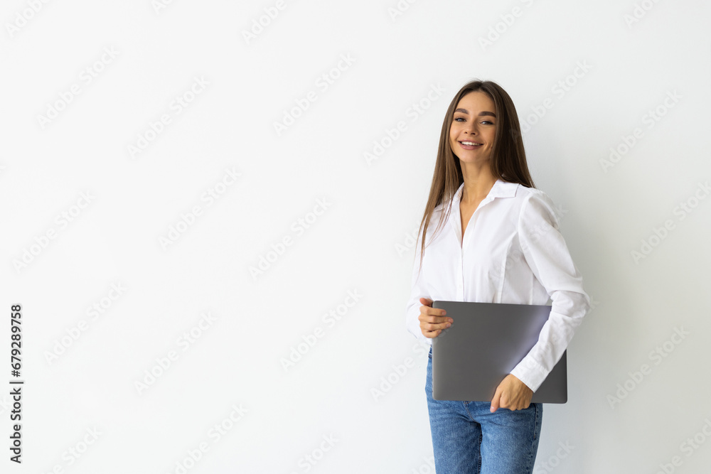 Portrait of a happy woman working on laptop isolated over white background Portrait of a happy woman working on laptop isolated over white background