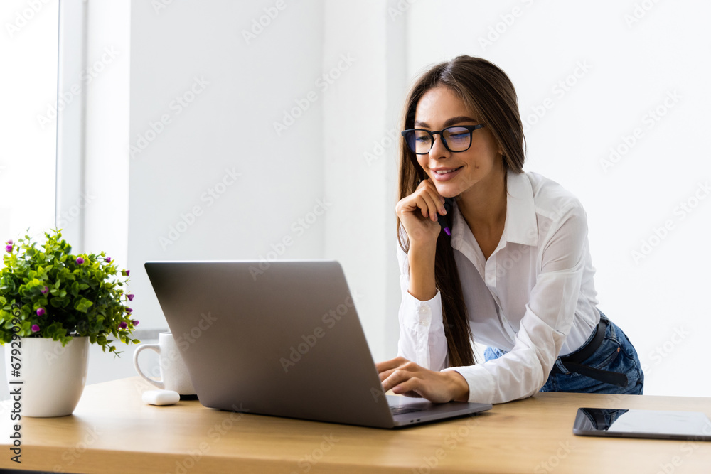 Cheerful and successful woman programmer at work inside modern office, tech support worker with laptop t