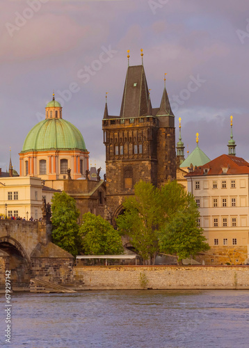 Obraz na płótnie View of old town with Charles Bridge (Karluv Most) on Vltava river and Old Town Bridge Tower, famous tourist destination in Prague, Czech Republic (Czechia), at sunset w salonie