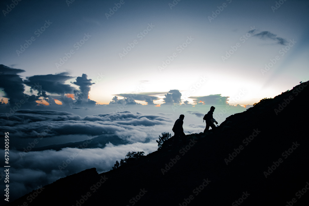 silhouette of a person in the mountains