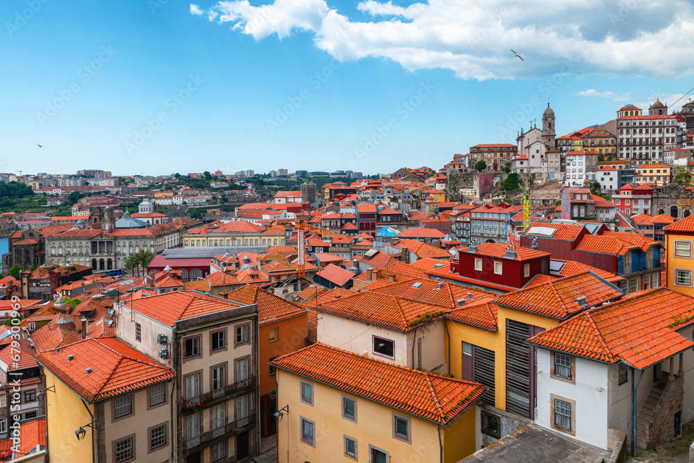 Aerial view of old town of Porto with orange rooftops buildings, Portugal. Medieval architecture of Oporto downtown. Travel destination