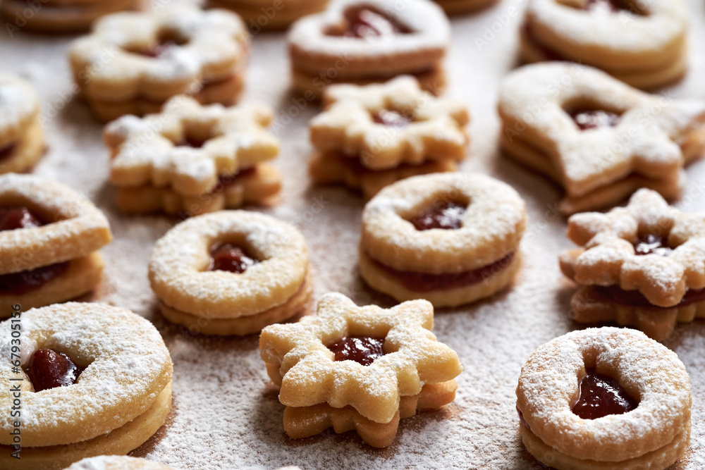 Traditonal Linzer Christmas cookies filled with marmalade and dusted with sugar