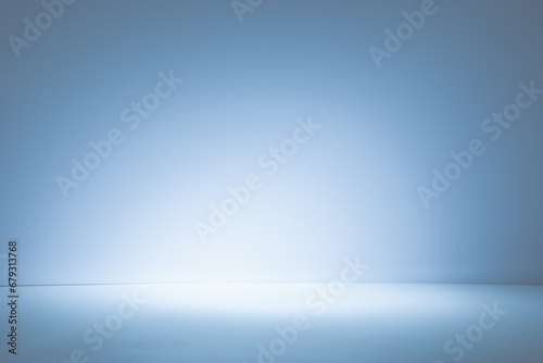 Empty light blue background for product presentation with light and shadow on the wall and floor