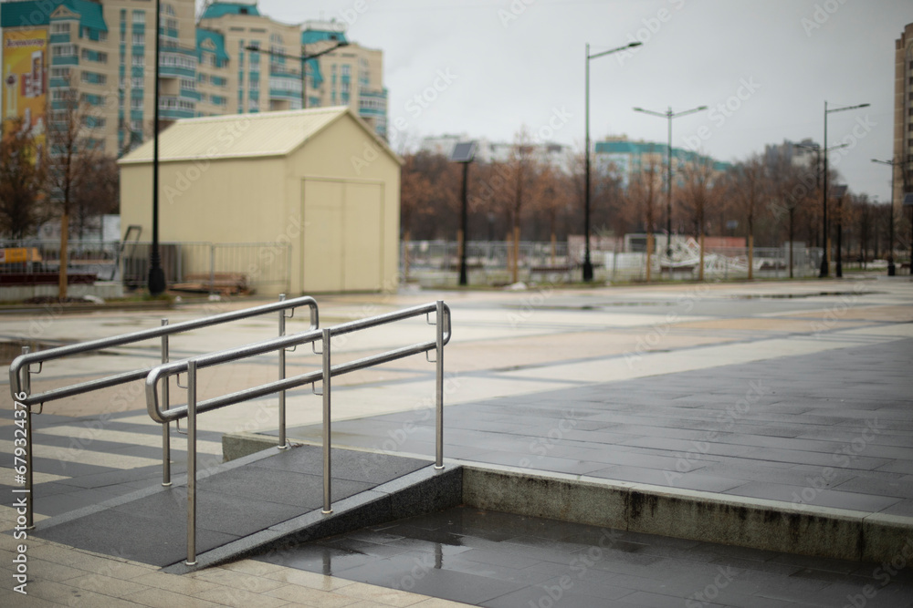 Comfortable environment for people with disabilities. Handrail on the square. Barrier-free urban environment.