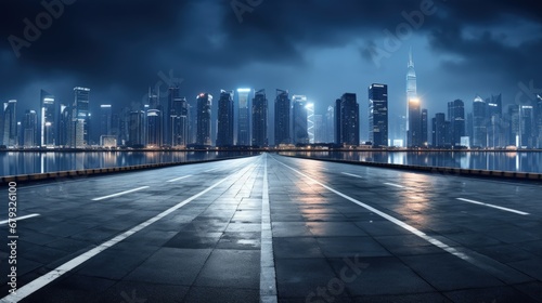 Asphalt road and modern city skyline with buildings in Hangzhou at night.