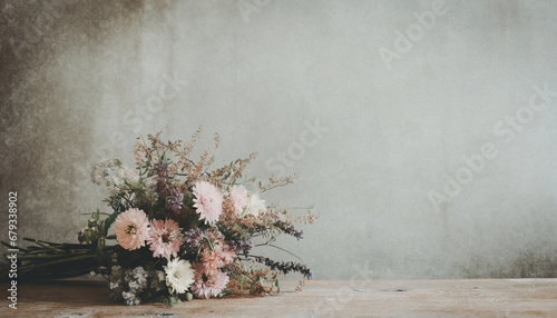wild flower bouquet on vintage table; widescreen wallpaper / background with text space