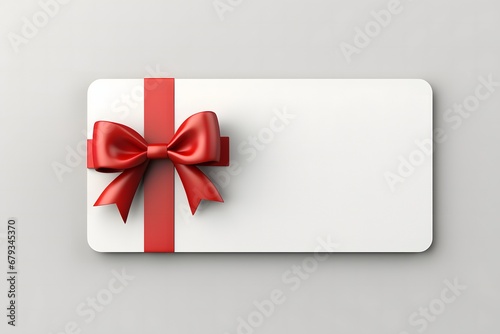 Blank white gift card with red ribbon bow isolated on grey background .