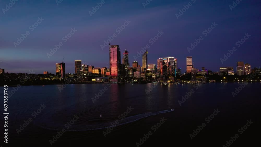 Aerial view on Perth downtown at night, downtown panorama from the riverside with the illuminated skyscrappers and the bridges Aerial view on Perth downtown at night, downtown panorama from the riverside with the illuminated skyscrappers and the bridges