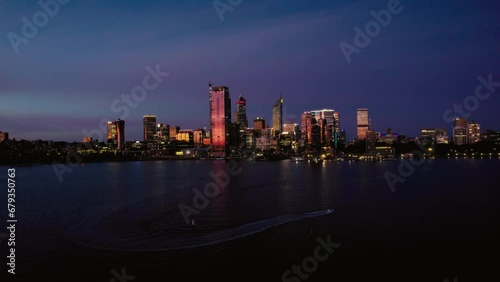 Aerial view on Perth downtown at night, downtown panorama from the riverside with the illuminated skyscrappers and the bridges photo