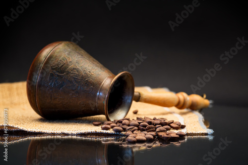 natural coffee beans, Turkish coffee pot on burlap