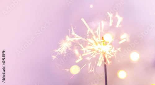 Beautiful sparkles from sparklers on the background of New Year s bokeh  Christmas mood  glitter  festive background.