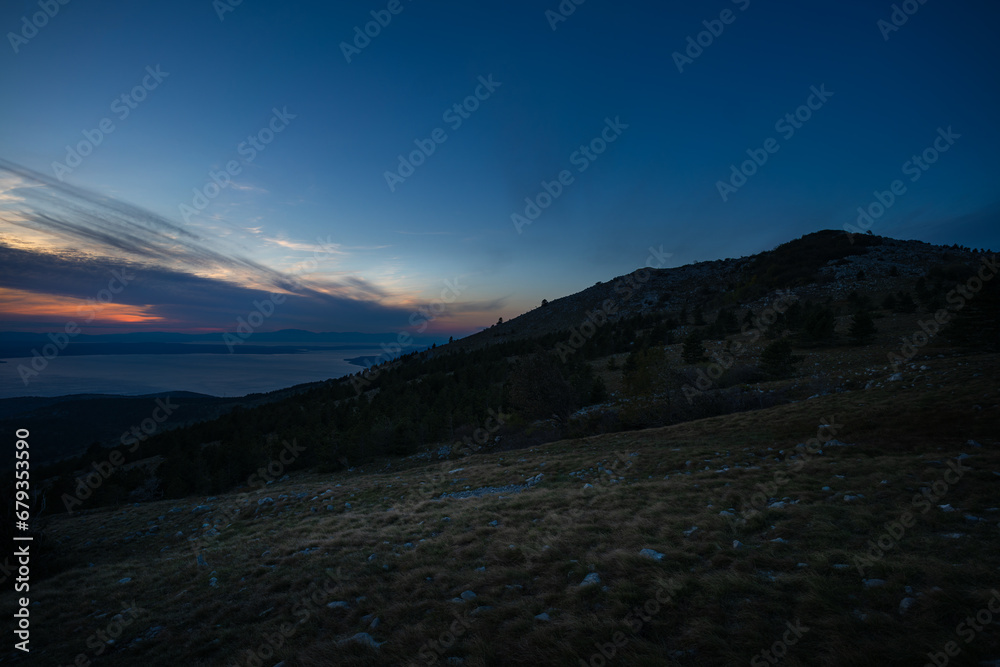 Atmospheric view over the Croatian Adriatic coast with its islands at sunset.