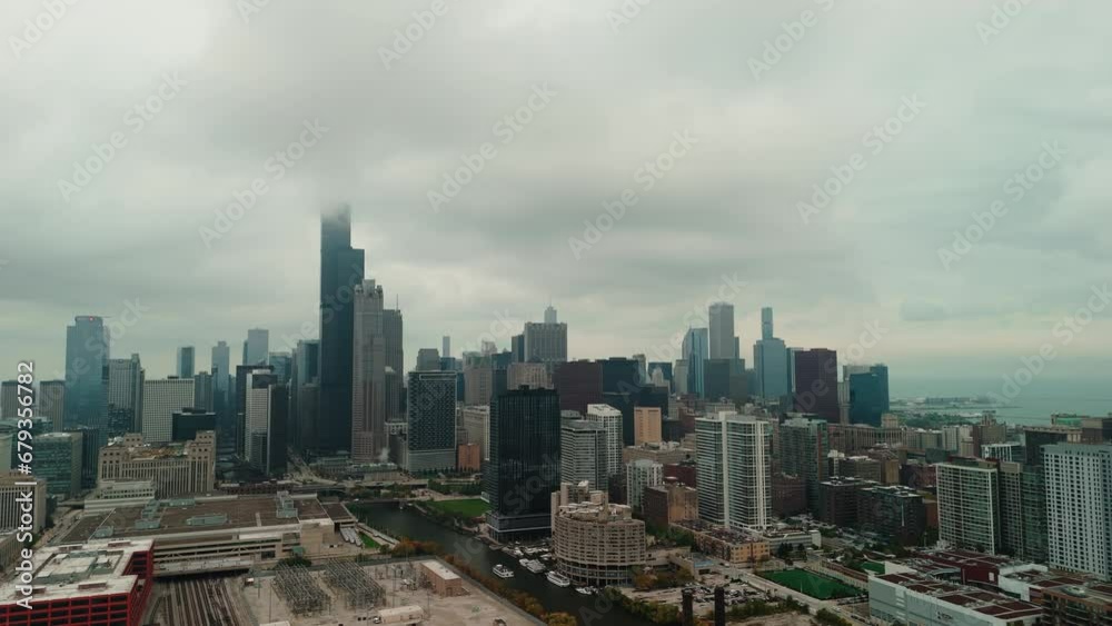 Aerial wide view Chicago on a foggy cloudy day. Cloudy day in downtown Chicago Illinois, skyscrapers and business centers of the central part of the city are covered with fog. Aerial wide view Chicago on a foggy cloudy day. Cloudy day in downtown Chicago Illinois, skyscrapers and business centers of the central part of the city are covered with fog.