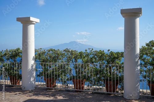 View to mount Vesuvio near Naples and Pompei from beautiful mediterranean Town Sorrento. Vesuvio framed by  green hedge and pillars photo