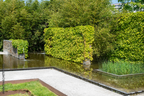 A pond in a modern landscape park. Minimalist geometrical landscape