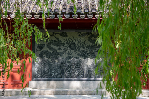 Japanese stone panel with dragons in the park photo