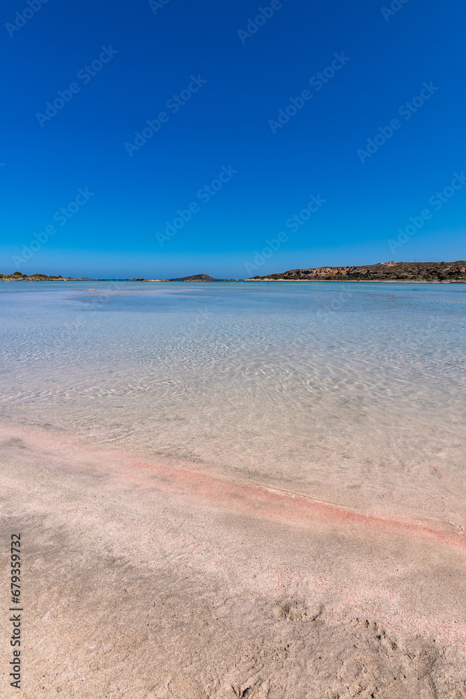 Beautiful view of Elafonisi Beach, Chania. The amazing pink beach of Crete. Elafonisi island is like paradise on earth with wonderful beach with pink coral and turquoise waters.