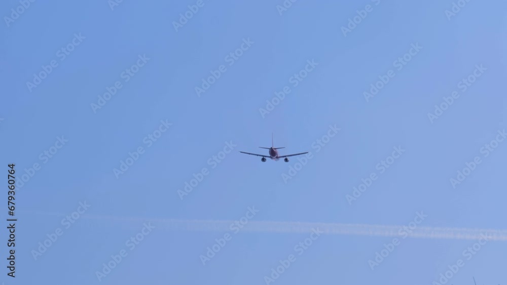 Airliner with passengers on the blue sky. The plane flies in the sky. The plane takes off against a clear sky. Airliner with passengers on the blue sky. The plane flies in the sky. The plane takes off against a clear sky.