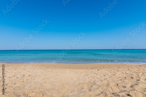 View of the sea in the Island with sandy beach, cloudless and clear water. Tropical colours, peace and tranquillity. Turquoise sea. Falasarna beach, Crete island, Greece. photo