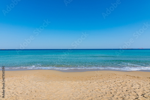 Fototapeta Naklejka Na Ścianę i Meble -  View of the sea in the Island with sandy beach, cloudless and clear water. Tropical colours, peace and tranquillity. Turquoise sea. Falasarna beach, Crete island, Greece.