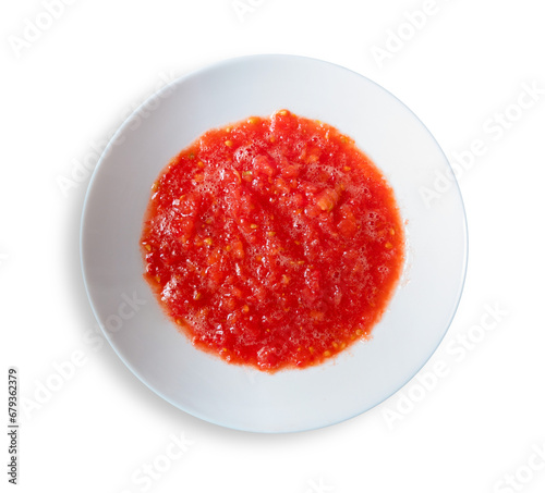 Plate of raw crushed natural tomato isolated on transparent background, top view