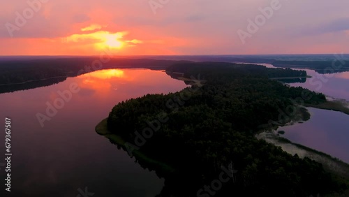 Scenic sunset landscape of Lake Baltieji Lakajai. Beautiful evening panorama of a major lake of glacial origin located in Labanoras Regional Park, eastern Lithuania. photo