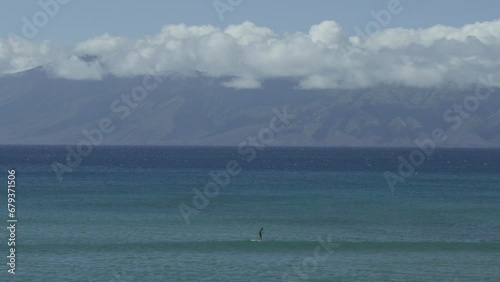 Stand up paddle board surfer paddling looking for waves (ID: 679371506)