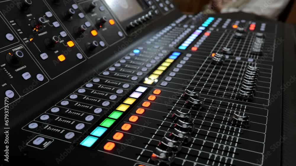 Remote control for sound adjustment. Audio mixer. Remote control for sound adjustment. Recording studio. Music production. Professional instrumental sound engineer in the studio or at a concert. Remote control for sound adjustment. Audio mixer. Remote control for sound adjustment. Recording studio. Music production. Professional instrumental sound engineer in the studio or at a concert.