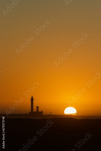 sunset and a lighthouse